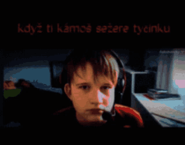 a pixelated image of a man wearing a headset with the words " kdyz ti kamos sezere tycinku " above him