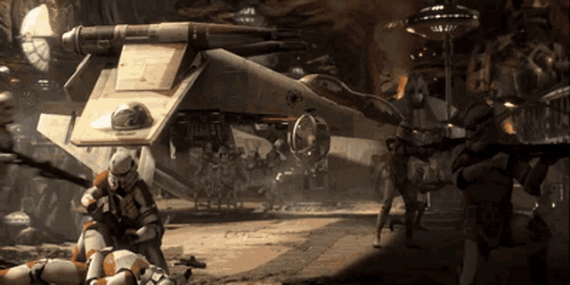 a group of soldiers are standing in front of a star wars fighter jet