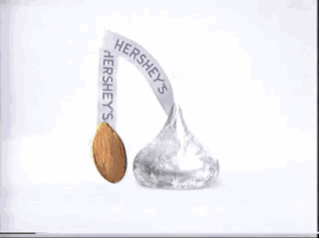 a hershey 's kiss with an almond on top of it