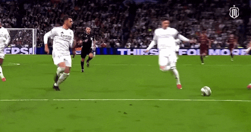 a soccer game is being played in front of a pepsi ad