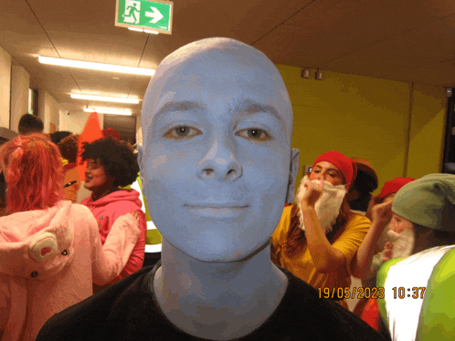 a photo of a man with blue paint on his face was taken on 19/05/23 at 10:37