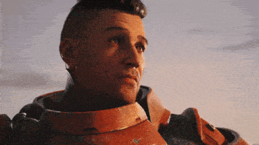 a close up of a man wearing a red armor with the word coca cola on it
