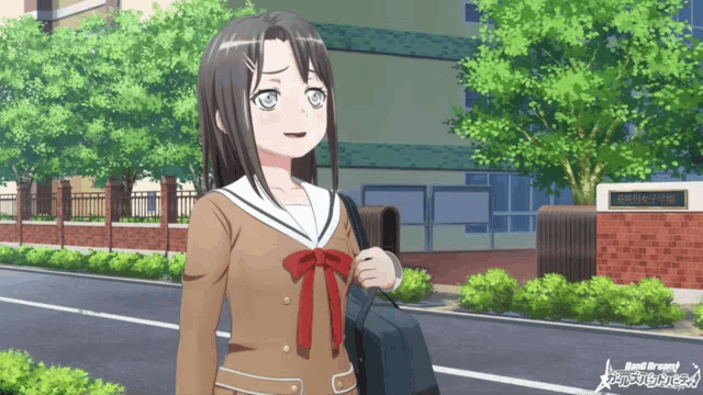 a girl in a school uniform is standing in front of a building with a sign that says band dream