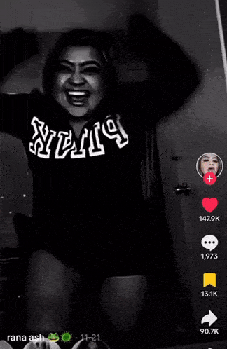 a black and white photo of a woman wearing a shirt that says ' stv ' on it