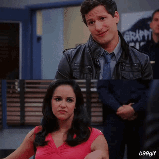 a man in a leather jacket stands next to a woman in a pink dress