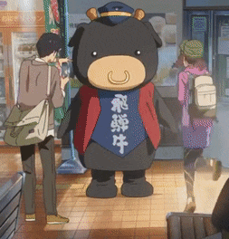 a black bear mascot with chinese writing on his vest
