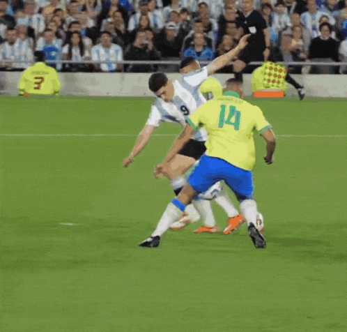 a soccer player with the number 9 on his shorts is kicking a ball