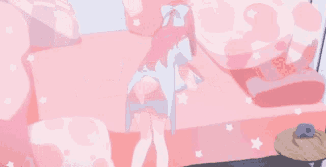 a girl is standing on a pink couch in a room .