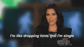 a woman says " i 'm like dropping hints that i 'm single " while smiling