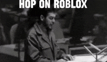 a black and white photo of che guevara with the words hop on roblox