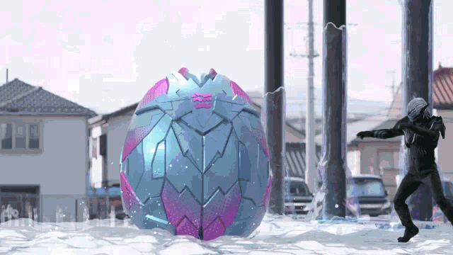 a man in a helmet is standing in front of a large blue and pink object