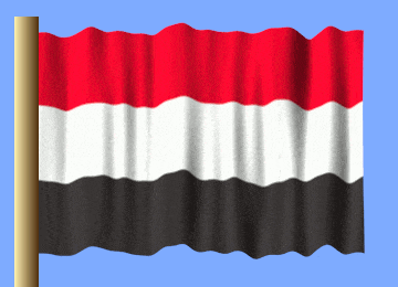 a red white and black flag is waving in the wind against a blue sky