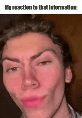 a close up of a man 's face with a caption that says my reaction to that information
