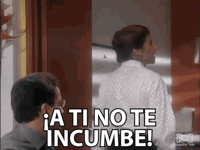 a man and a woman are standing next to each other and the woman is saying a ti no te incumbe