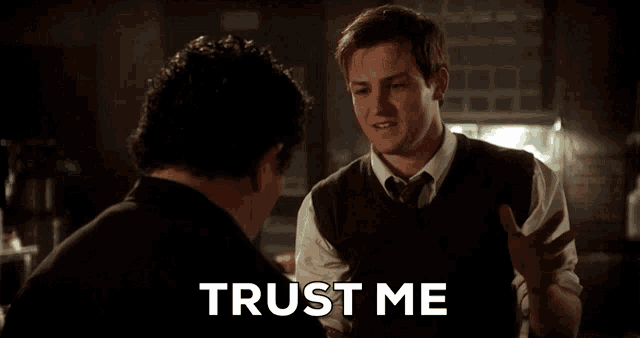 a man talking to another man with the words " trust me " on the bottom