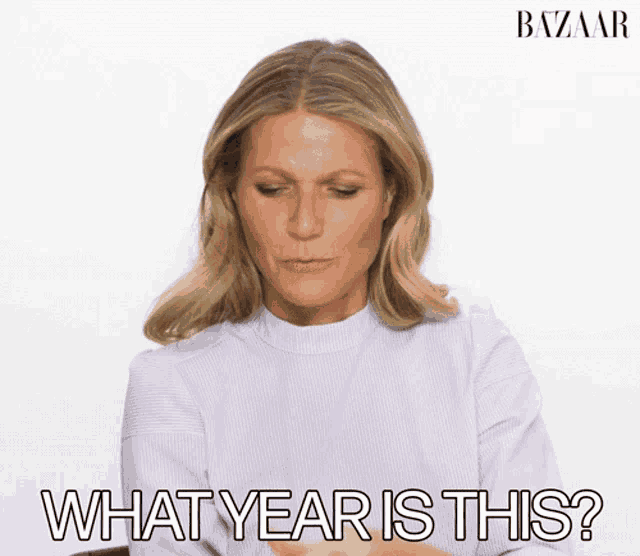 a woman says what year is this in front of a harper 's bazaar ad