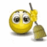 a smiley face is holding a broom in his hand .