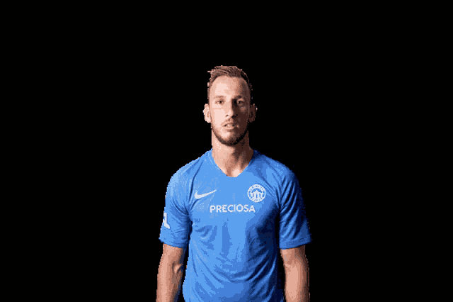 a man in a blue shirt that says preciosa