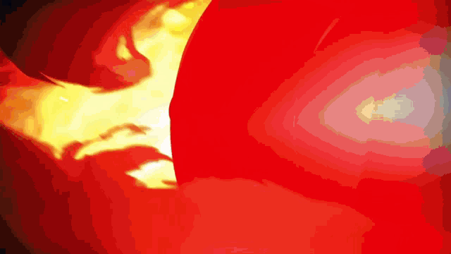 a close up of a red and yellow background with a white circle in the middle
