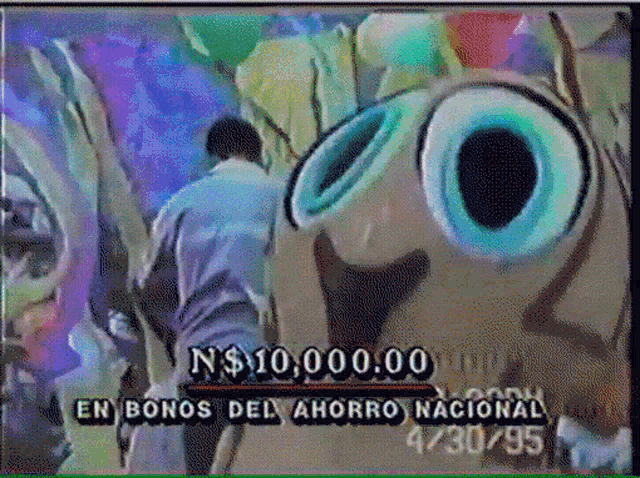 a man is standing in front of a painting that says en bonos del ahorro