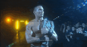 a shirtless wrestler is holding a world heavyweight wrestling championship belt