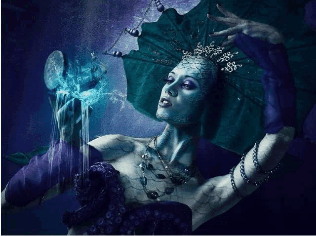 a woman with blue paint on her face and purple gloves is holding something in her hand