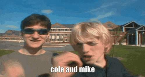 two men wearing sunglasses are standing next to each other and one of them says cole and mike in front of a building