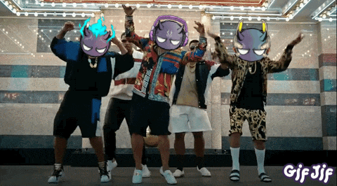 a group of men are dancing in front of a sign that says gif jjf