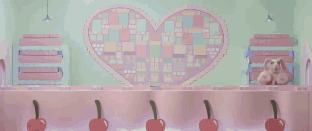 four stuffed animals are standing in front of a pink heart