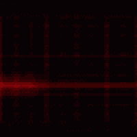 a red heart is glowing in the dark on a black background