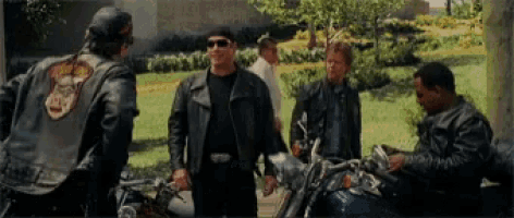 a man in a leather jacket has a patch on his back that says ' biker '