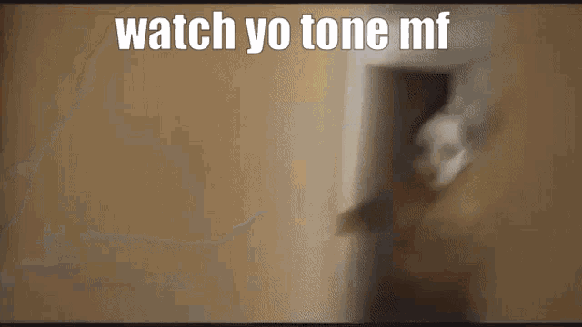 a close up of a person 's mouth with the words " watch yo tone mf " on the bottom