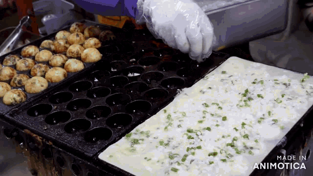 a person is cooking food on a grill and the words made in animotica are on the bottom right