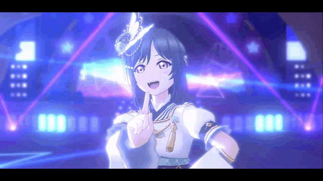 a girl in a hat is giving a peace sign in front of a stage