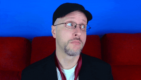 a man wearing glasses and a hat looks up at something