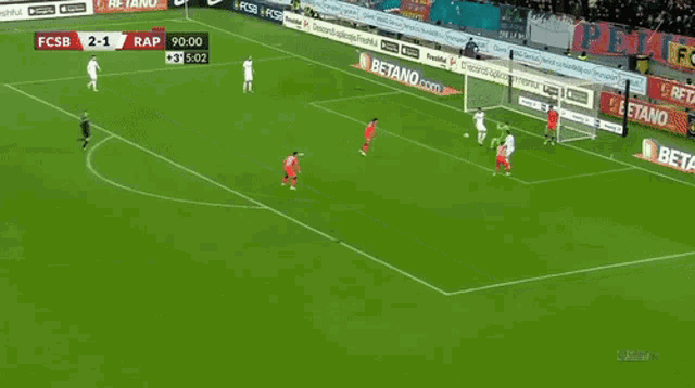 a soccer game is being played on a field sponsored by betano.com and nike