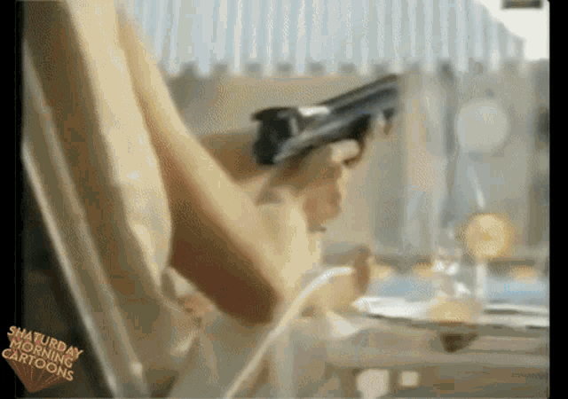 a cartoon of a woman holding a gun with saturday morning cartoons on the bottom
