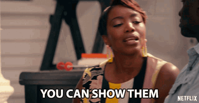 a woman says " you can show them " while standing next to a man
