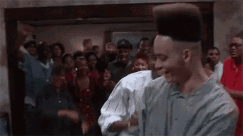 a group of people are dancing together in a room .