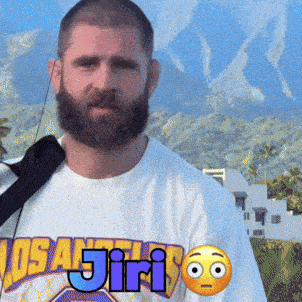 a man with a beard wears a los angeles t-shirt