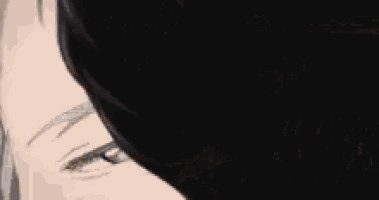 a close up of a person 's face with a black background and their eyes closed .