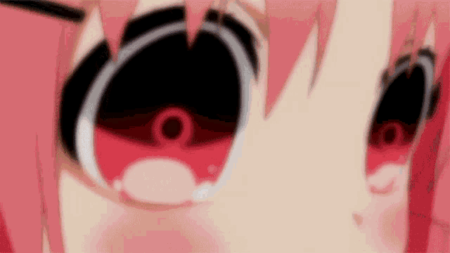 a close up of a girl 's eyes with a circle in the middle .