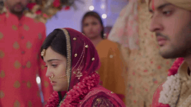 a bride and groom are walking down the aisle at their wedding ceremony