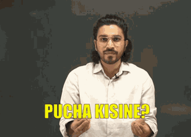 a man wearing glasses and a white shirt is saying kisine nahi pucha