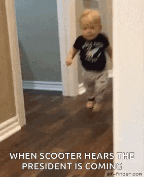 a baby is running through a hallway in a house .