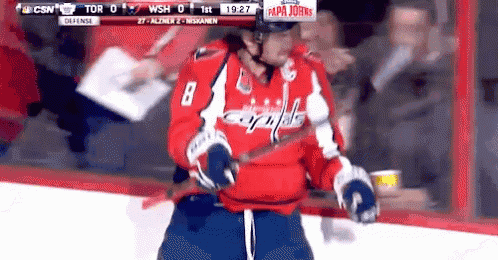 a hockey player with the number 8 on their jersey