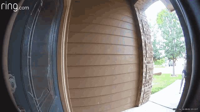 a ring.com doorbell shows a person standing in the doorway