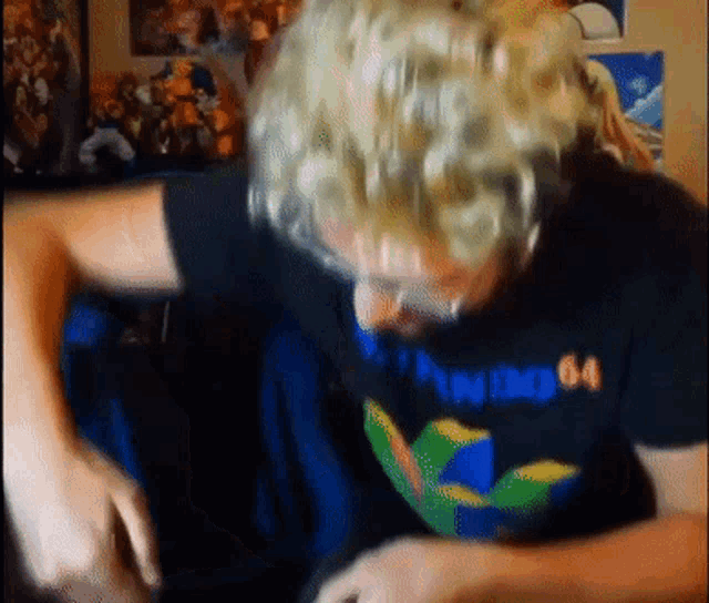 a man wearing a black shirt that says nintendo 64
