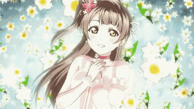 a girl in a pink dress is surrounded by flowers .