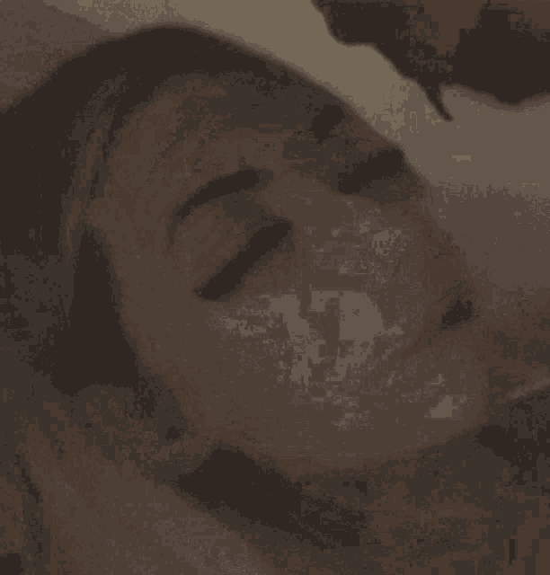a close up of a woman 's face with a headband on
